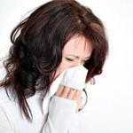 Woman sneezing and blowing her nose. 16FluAbsent. BUSINESS